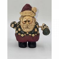 Front view of Santa figurine showing checked coat and spinning arms mechanism.