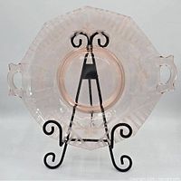 Front view of plate on stand showing overall form and handles