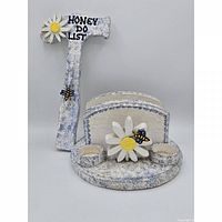 Set of two blue and white wooden napkin holders with daisy and bee decorations and Honey Do List text