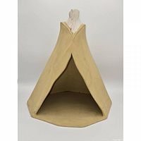 Front view of hollow ceramic teepee sculpture showing entrance, beige body, white top
