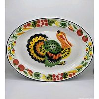 Front view of oval enamel turkey platter showing full design