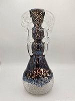 Full view of vase front showing form, colors, size reference