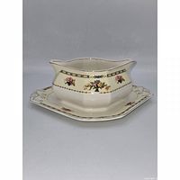 Front view of gravy boat resting on underplate