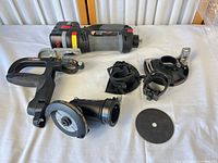 Full view of tool body, handle, multiple guards, dust adapter, disc