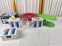 All items together: Bodum cartridges, Braun value pack, red plate, green container, crystal snifter