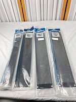 Four sealed Middle Atlantic rack panels laid out side by side