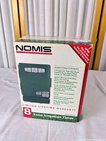 Front of Nomis 8-zone irrigation timer box