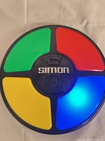 Front view showing all four colored pads and Simon logo