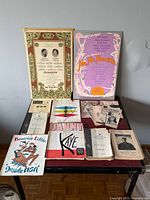 Overall lot showing two large posters and multiple programs spread on table