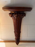 Full view of carved mahogany wall sconce shelf