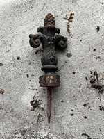 Full view of cast iron finial showing decorative top, collar and spike