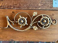 Full view of gilt wrought iron floral architectural piece showing overall form and size