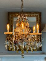 Full view lit showing six lights, crystals, chain