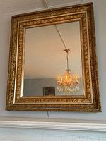Full view of mirror hanging on wall