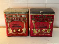 Front view of both Ocean Blend tea tins