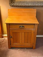 Front view of wash stand showing drawer, cabinet door, hardware and overall style