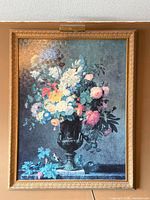 Framed floral print with picture light, front view