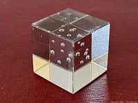 glass cube paperweight showing bubble pattern