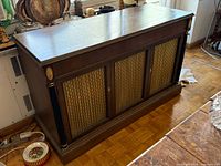 Full view of closed Electrohome stereo console cabinet