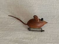 Side view showing full mouse brooch with tail and clasp