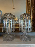 Front view of both cut crystal lusters showing prisms and bases