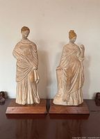 Both Royal Ontario Museum clay figurines on bases