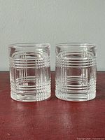 Two Ralph Lauren crystal scotch glasses front view