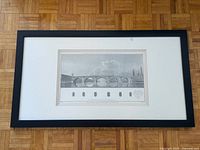 Full view of framed etching showing frame, mat, and print