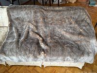 Full view of faux fur throw blanket spread out