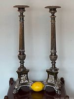 Both candlesticks front view with lemon for scale