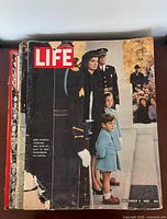 Front view of stack with December 6 1963 Life issue on top, additional issues beneath