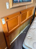 Front view of pine headboard showing three recessed panels