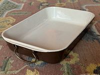 Top angle showing interior white enamel and metal handle