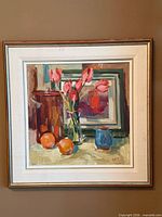 Framed still life painting on wall