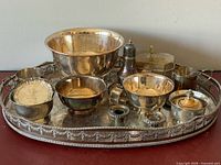 Group view of tray with all silver plate pieces displayed
