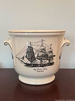 Front view showing Windsor Castle ship image and pedestal base