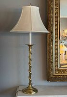 Full view of brass spiral lamp with shade
