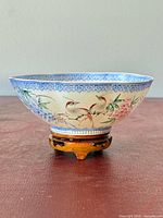 bowl on stand showing exterior bird and flower painting