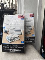 Front view of two sealed Mainstays Bedding & Linen Vacuum Storage Bag Set boxes