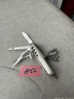 multi-tool opened showing various blades and tools