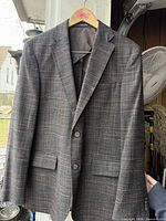 Front view of Joseph Abboud plaid blazer on hanger