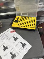 Licota letter stamp set in open case on table