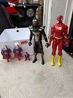 Group shot of all five figures standing on tabletop