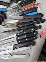 Overview of all knives laid out on surface