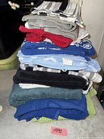 Stack of assorted towels showing variety of colors and patterns