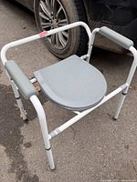 Commode front view with lid closed