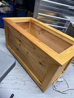 angled view of pine box exterior and interior