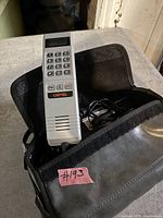 Grey Cantel handset with keypad inside black pouch