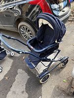Full view of Peg Perego Martinelli stroller showing frame, canopy and wheels