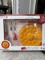 Front of sealed Celebrate It Bake With Me cake baking kit showing all components